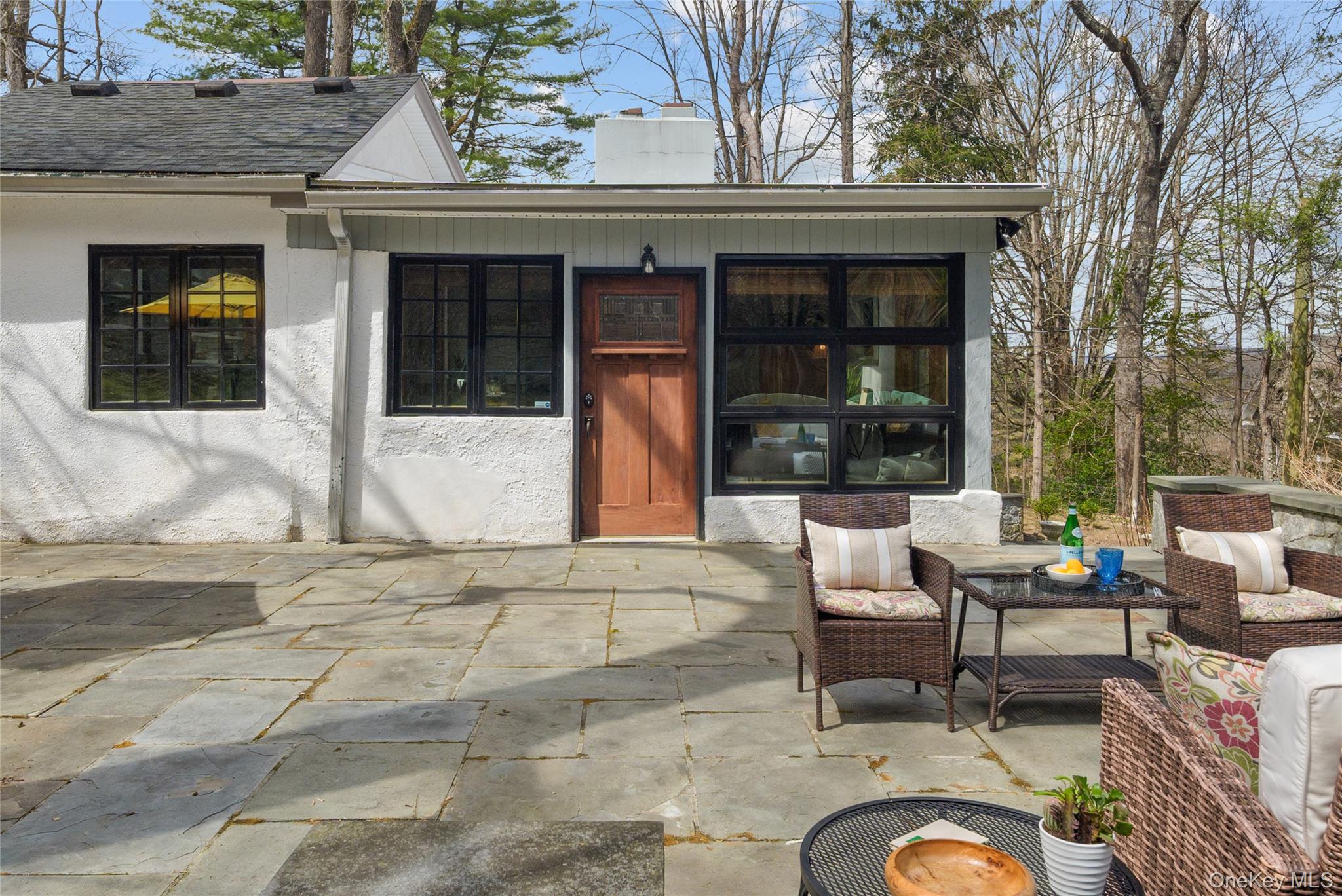 241 West Mt Airy Road Croton-on-Hudson, NY 10520 - Photo 4 of 41 a building outdoor space with patio furniture and potted plants