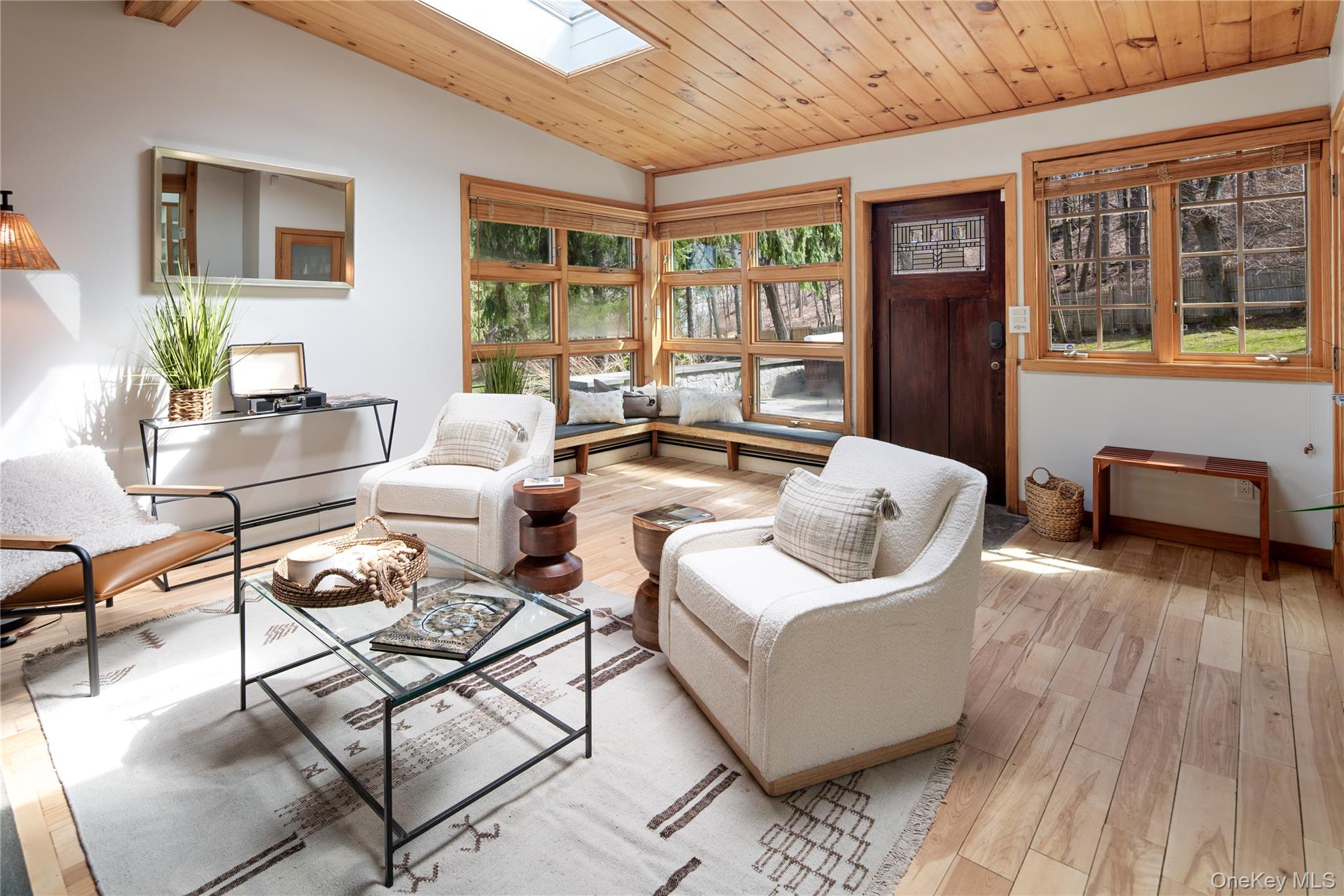 241 West Mt Airy Road Croton-on-Hudson, NY 10520 - Photo 9 of 41 a living room with furniture and a floor to ceiling window