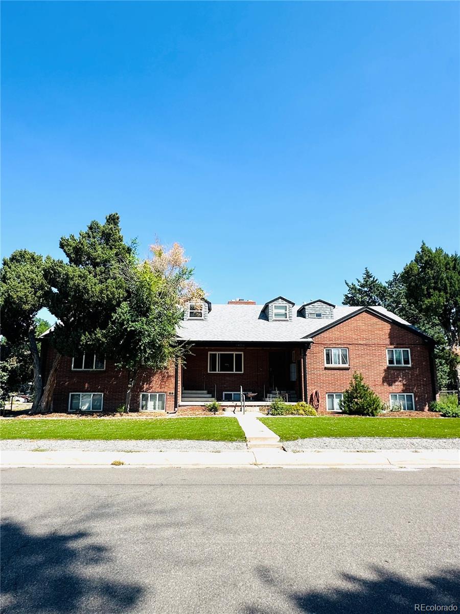 1400 South Clermont Street, Unit 9 Denver, CO 80222 - Photo 1 of 9 a view of a house with a big yard and large trees