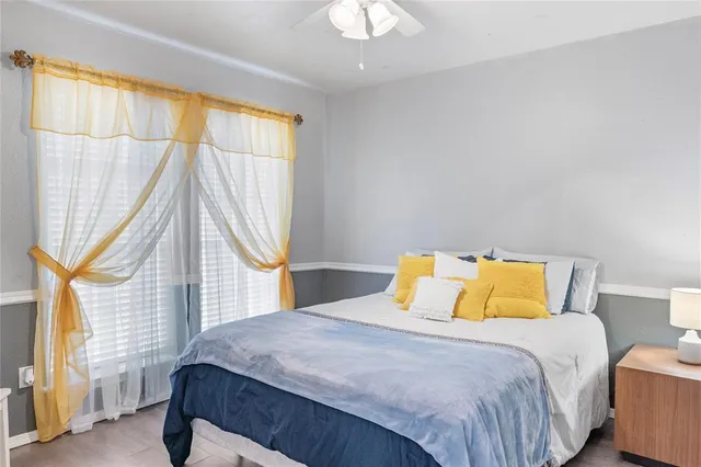 a bedroom with a bed and a window