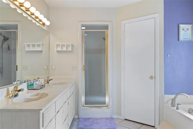 a bathroom with a sink a shower and a mirror