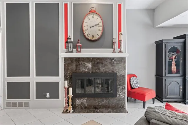 a living room with a couch and a fireplace