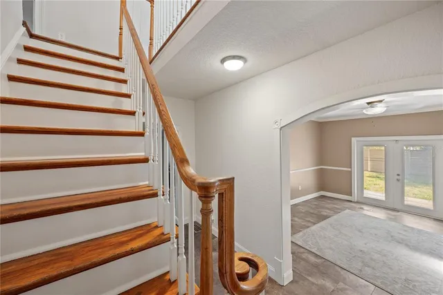 a view of an empty room with closet and window