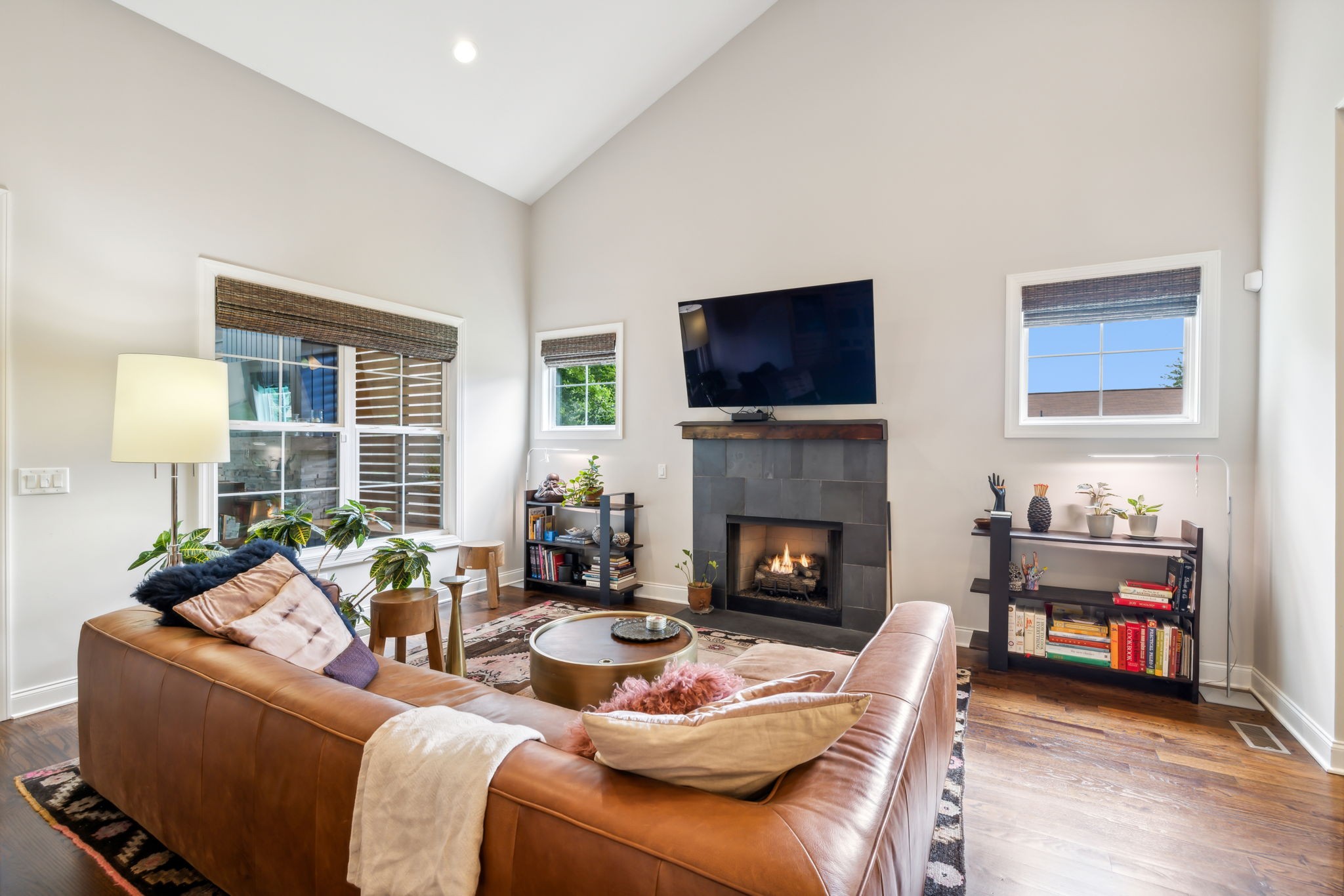 948 Glass Street Franklin, TN 37064 - Photo 11 of 40 a living room with furniture a flat screen tv and a fireplace