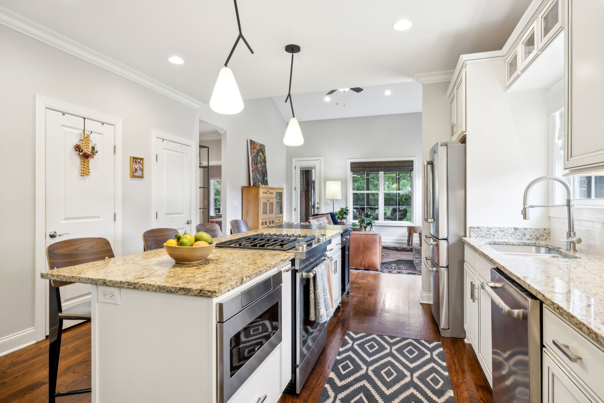 948 Glass Street Franklin, TN 37064 - Photo 8 of 40 a kitchen that has a sink a stove and a table in it
