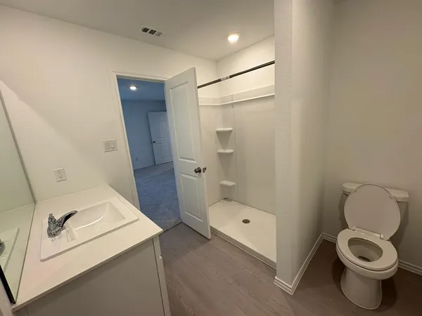 a bathroom with a toilet and a sink