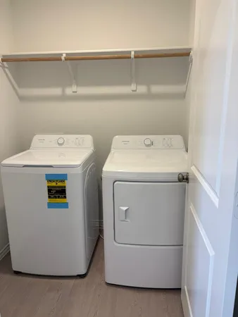 a utility room with dryer and washer