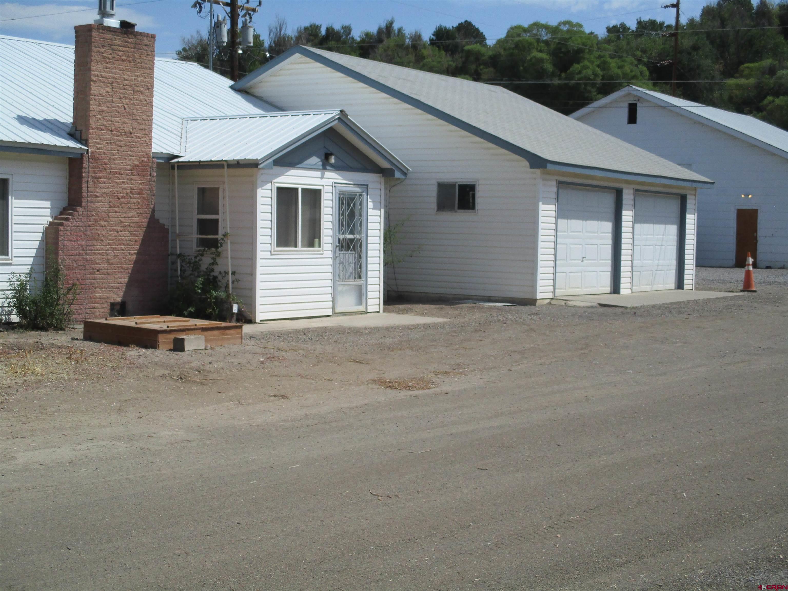 1102 Bluff Street Delta, CO 81416 - Photo 2 of 14 a view of a house with a street
