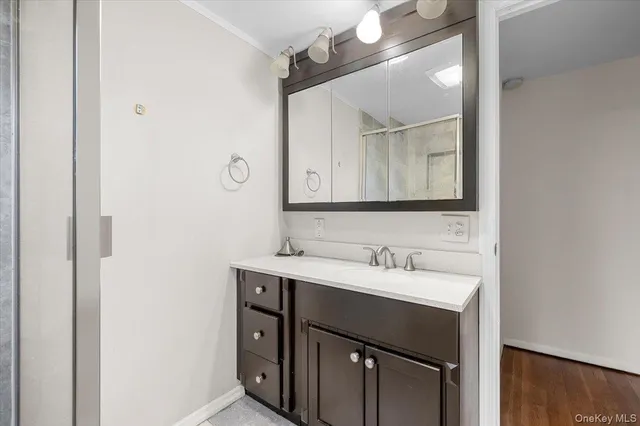 a bathroom with a sink and a mirror