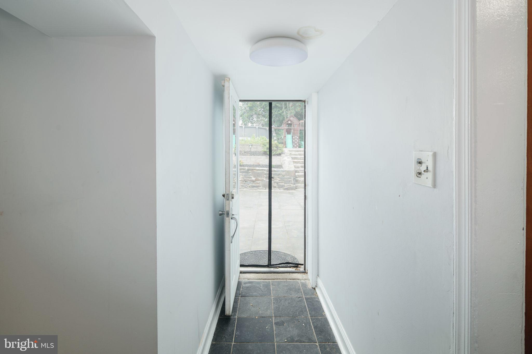 627 Ellis Road Havertown, PA 19083 - Photo 19 of 36 Hallway w/ Exit to Rear Patio