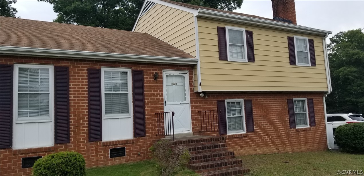 11524 Genito Road Midlothian, VA 23112 - Photo 1 of 31 a front view of a house with a garden