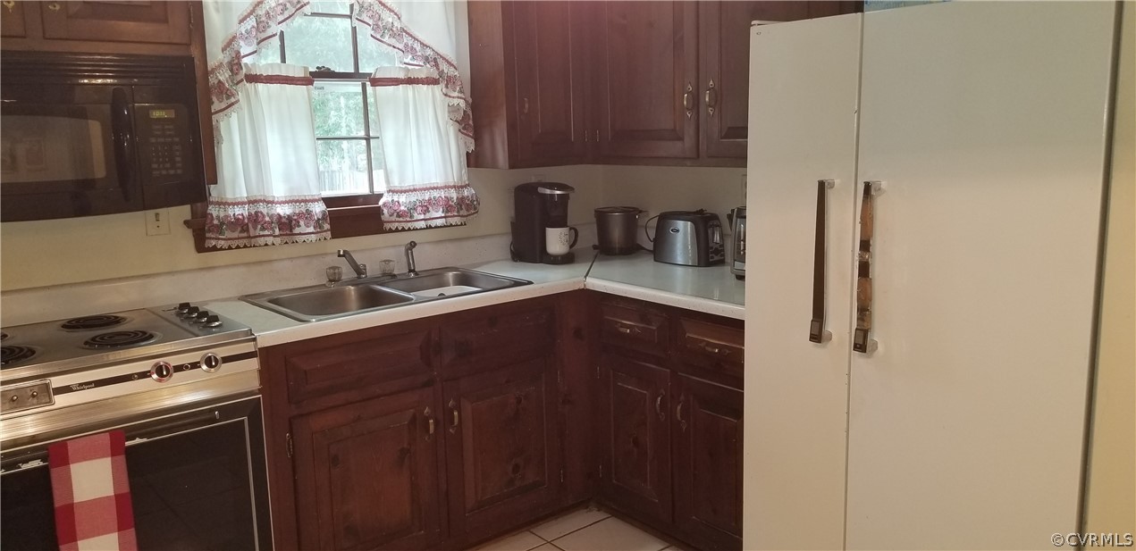 11524 Genito Road Midlothian, VA 23112 - Photo 17 of 31 a kitchen with a sink cabinets and window