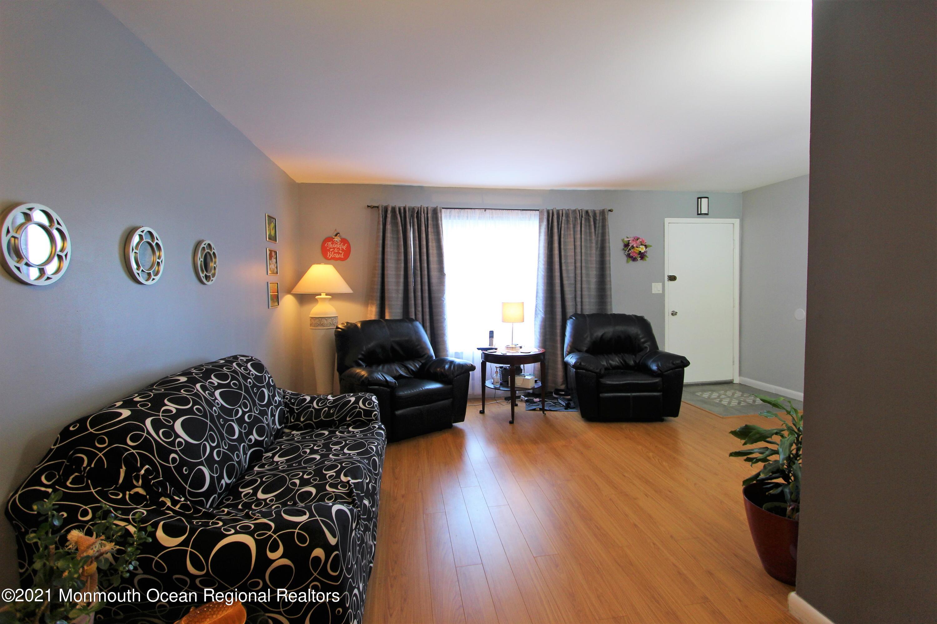 18 Rothbard Road Hazlet, NJ 07730 - Photo 11 of 23 a living room with furniture and a window