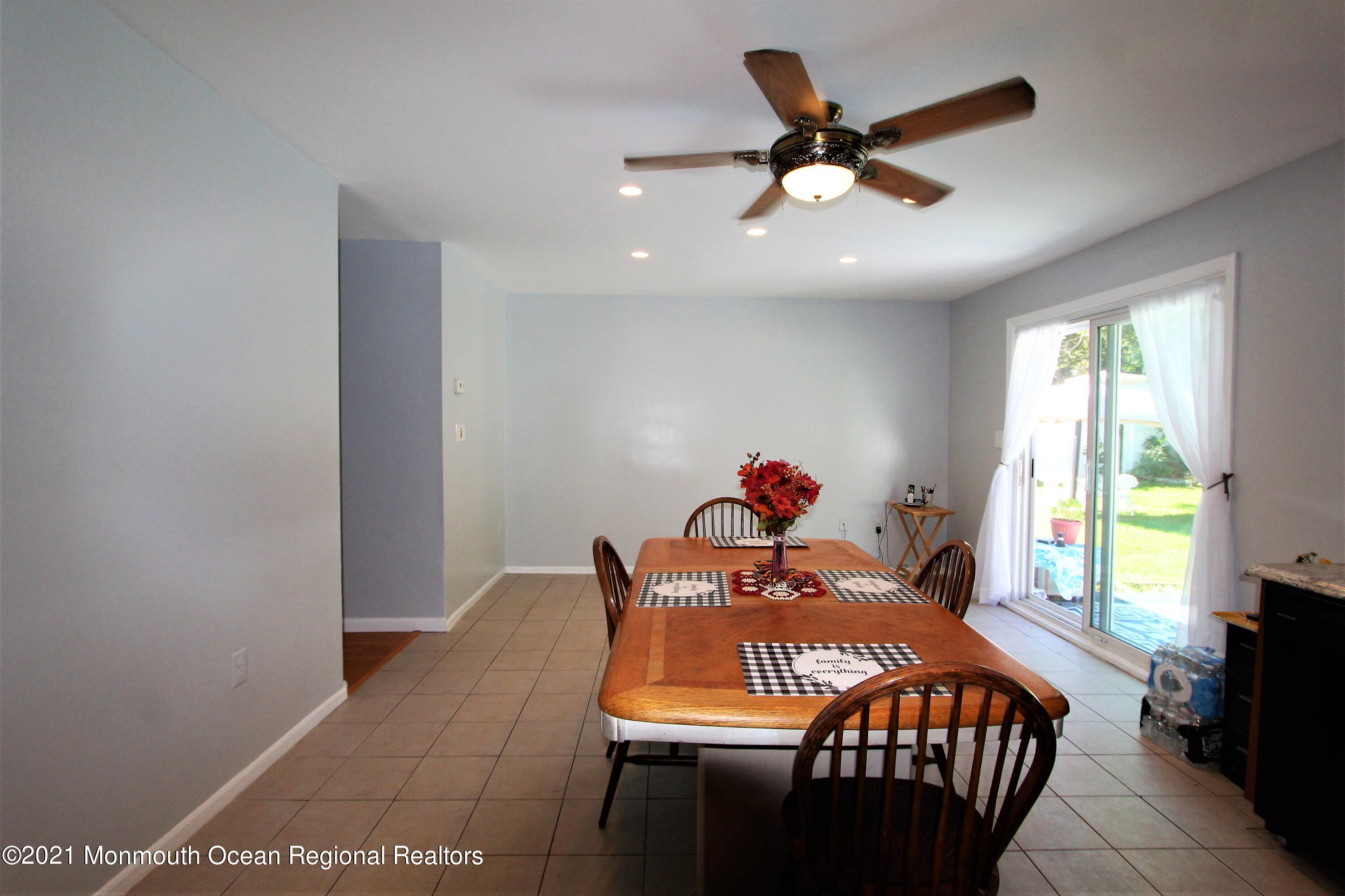 18 Rothbard Road Hazlet, NJ 07730 - Photo 15 of 23 a bed room with a bed and a ceiling fan