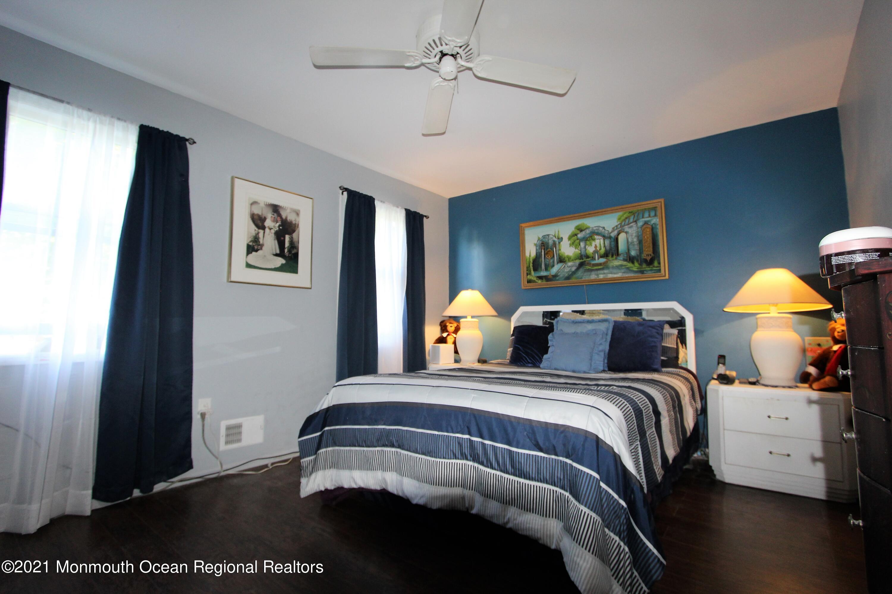 18 Rothbard Road Hazlet, NJ 07730 - Photo 20 of 23 a bedroom with a bed and a painting on the wall