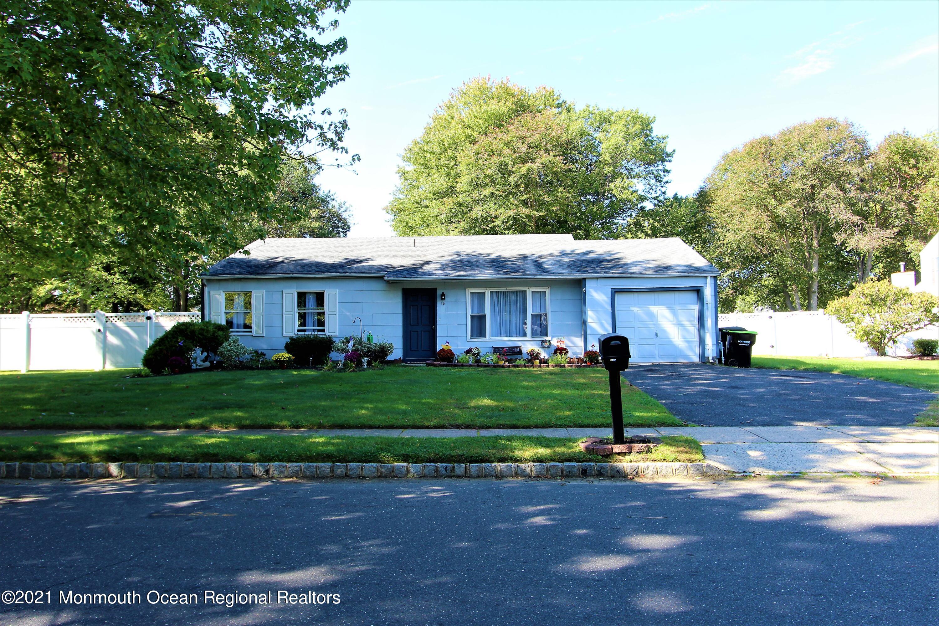18 Rothbard Road Hazlet, NJ 07730 - Photo 3 of 23 a view of a white house next to a yard with big trees