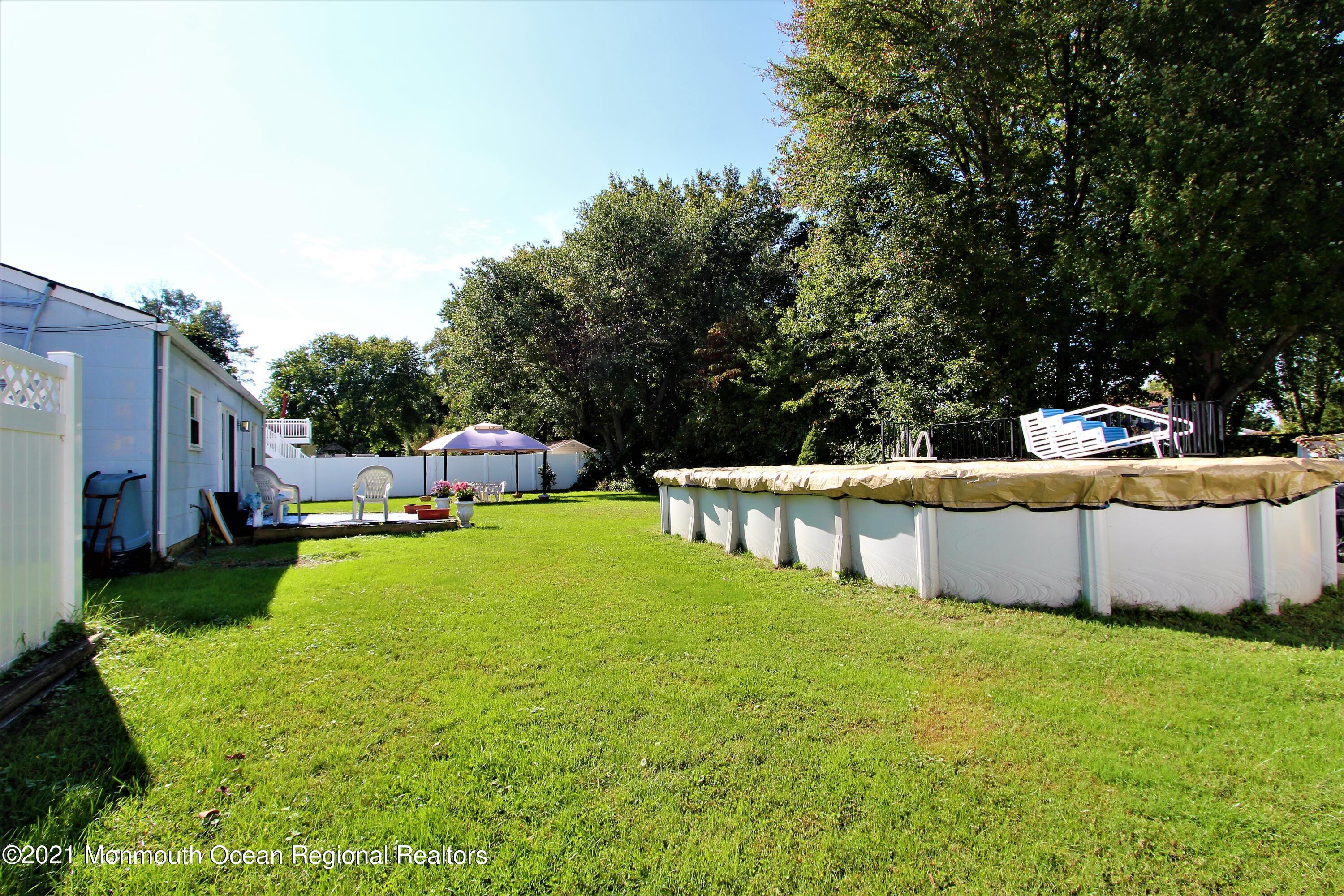 18 Rothbard Road Hazlet, NJ 07730 - Photo 5 of 23 a swimming pool with yard and outdoor seating