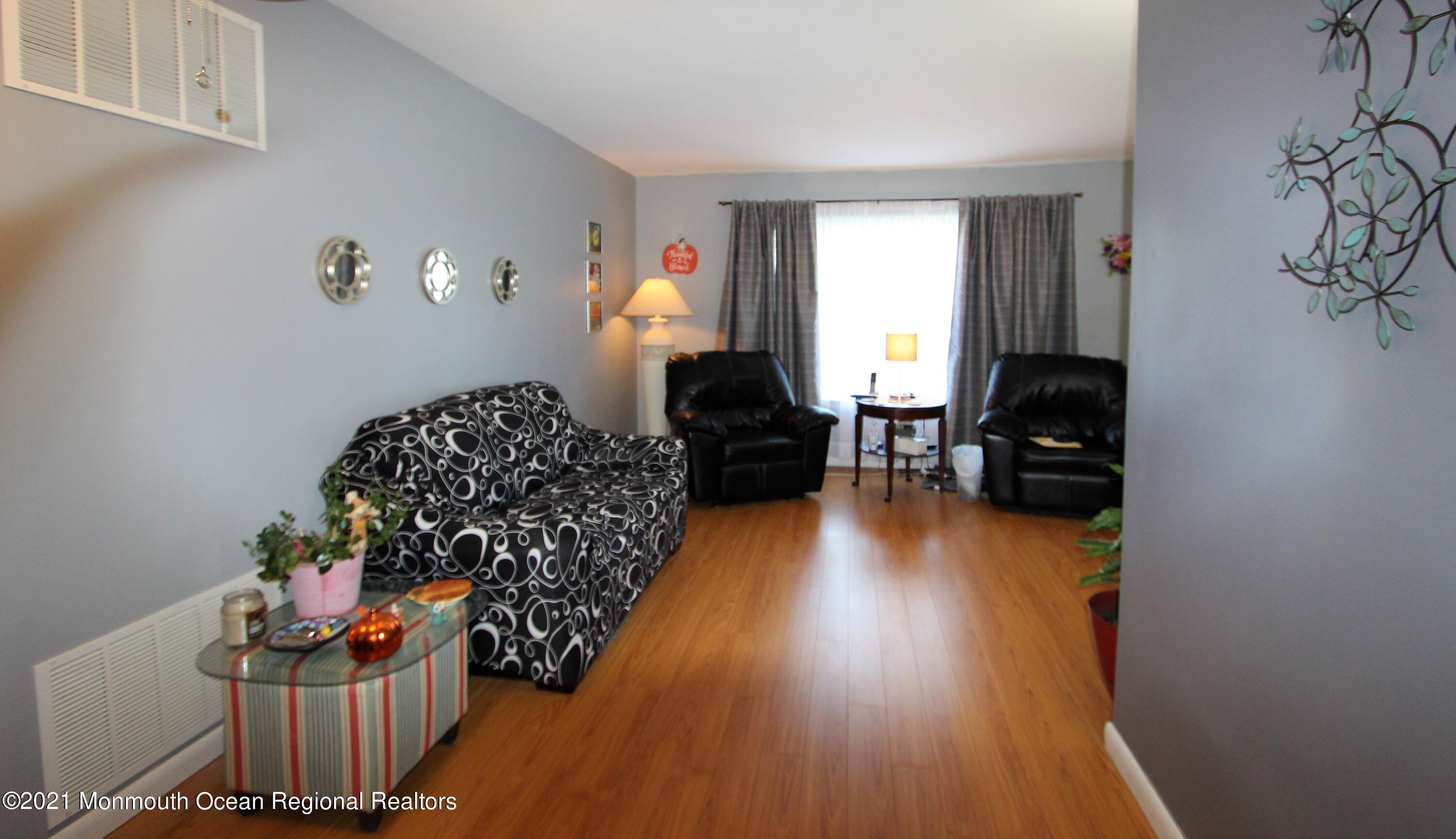 18 Rothbard Road Hazlet, NJ 07730 - Photo 10 of 23 a living room with furniture and a window