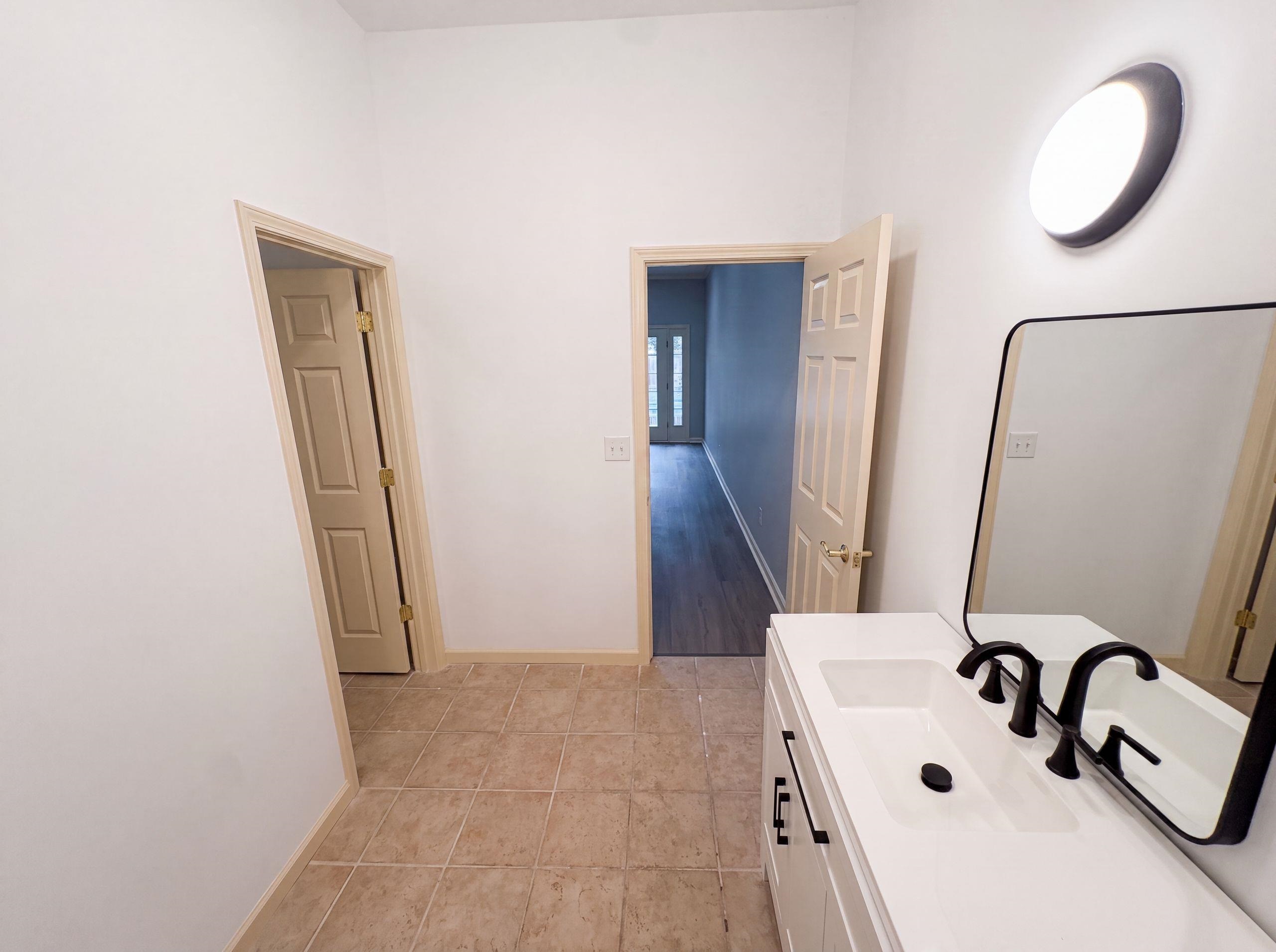 9424 Gotten Road Germantown, TN 38139 - Photo 19 of 27 Contemporary vanity with black hardware, rectangular sink, and matte black faucet