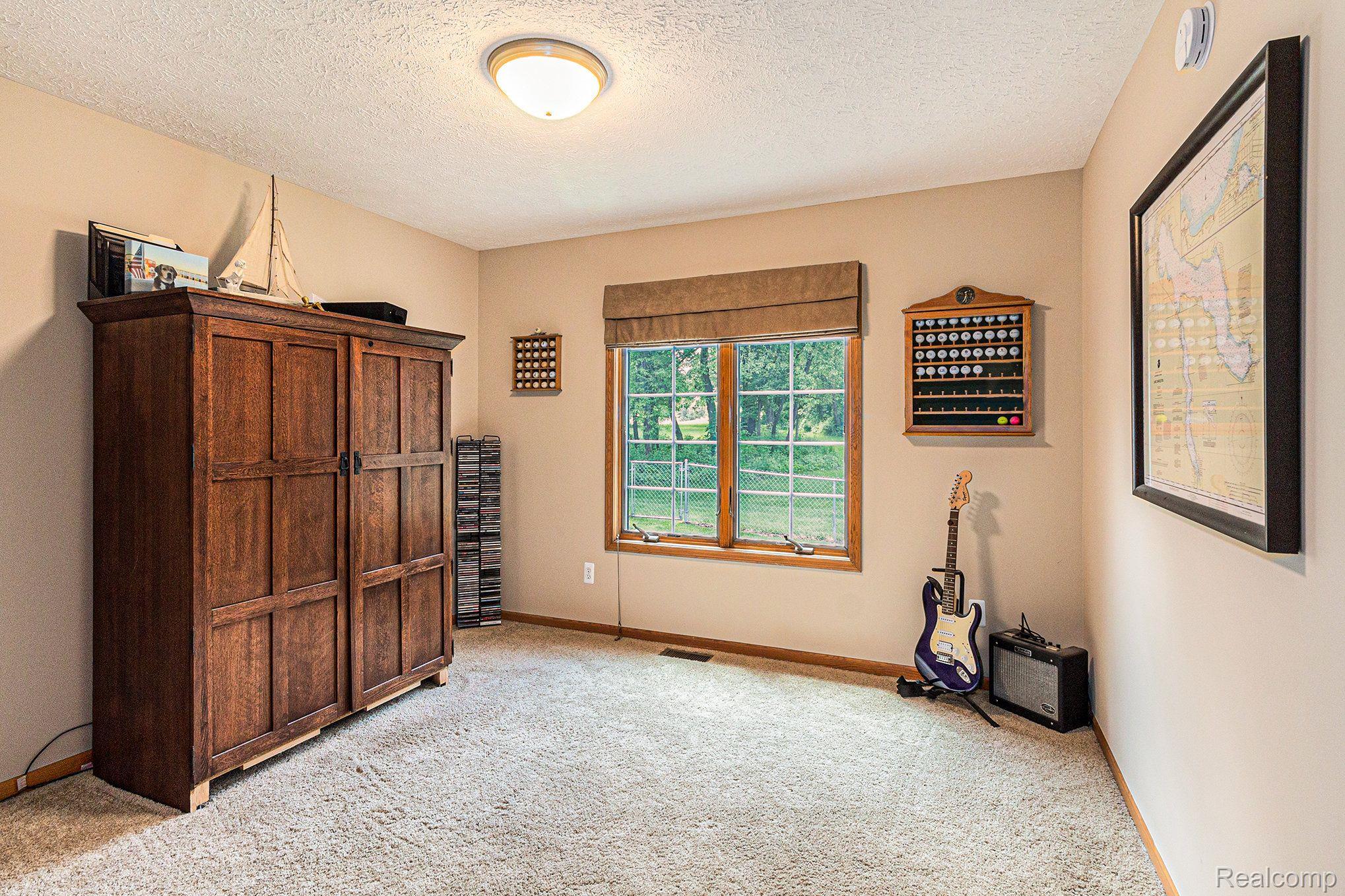 7611 East Highland Road Howell, MI 48855 - Photo 16 of 33 Front Bedroom