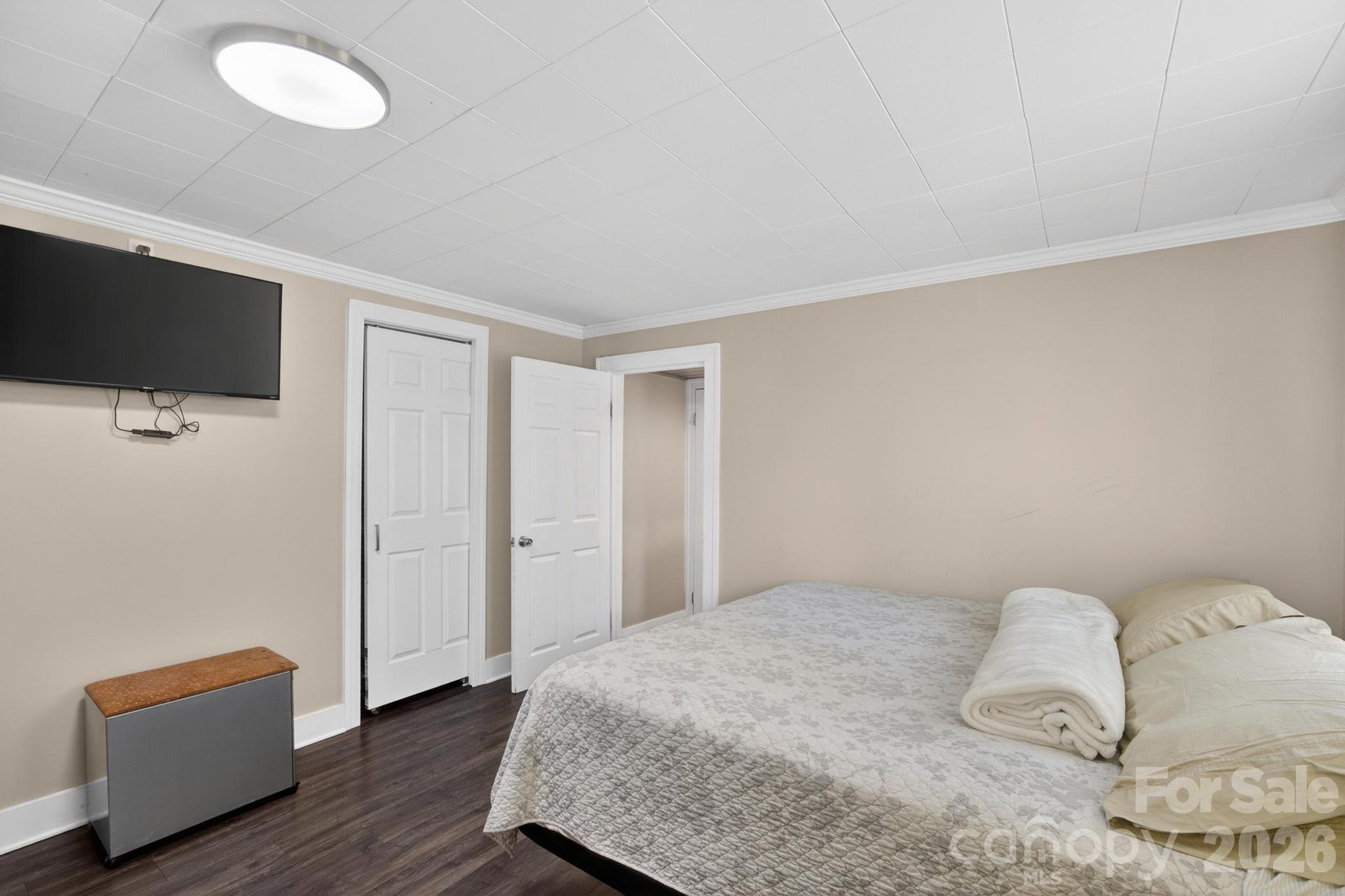 2076 Connelly Springs Road Lenoir, NC 28645 - Photo 27 of 47 a bedroom with a bed and flat screen tv