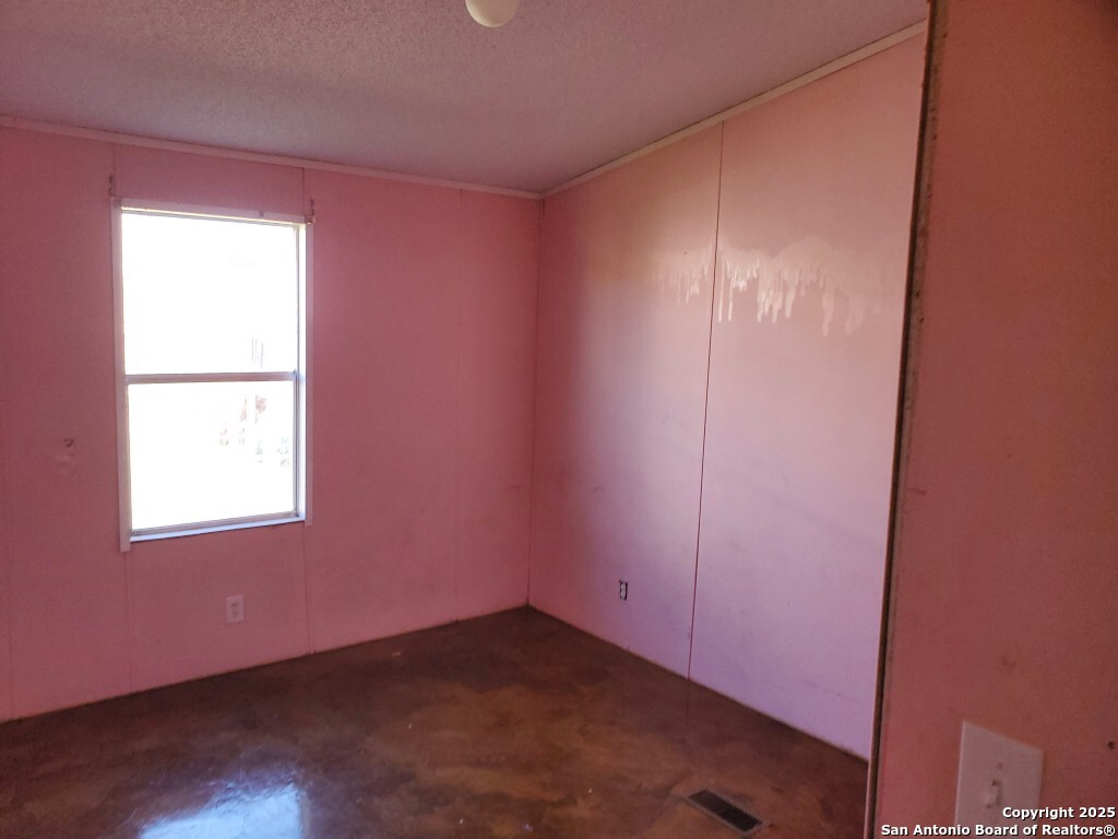754 Kayroe Road Adkins, TX 78101 - Photo 7 of 10 an empty room with windows