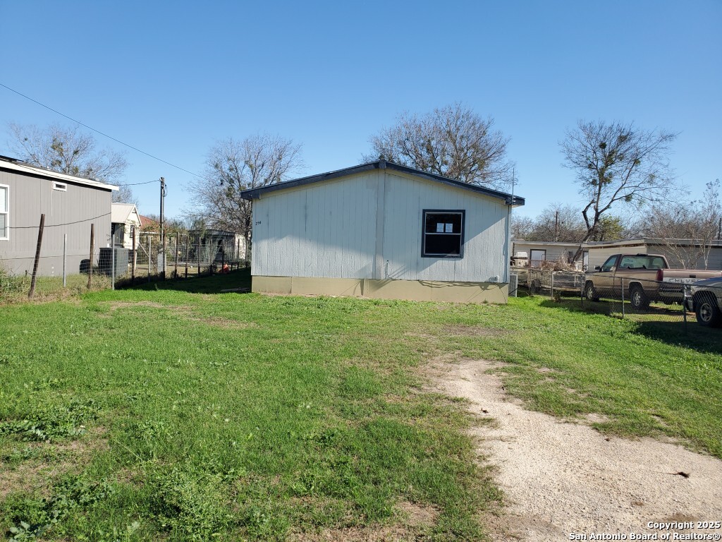754 Kayroe Road Adkins, TX 78101 - Photo 10 of 10 a house view with a garden space