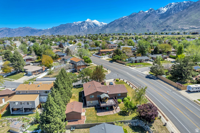 12080 Mill Ridge Circle Sandy, UT 84094 - Photo 44 of 56 Residential neighborhood setting with prominent mountain range backdrop