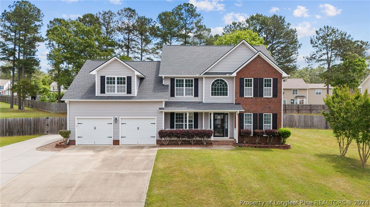 39 Fair Barn Road Sanford, NC 27332 - Photo 1 of 48 a front view of a house with swimming pool and porch