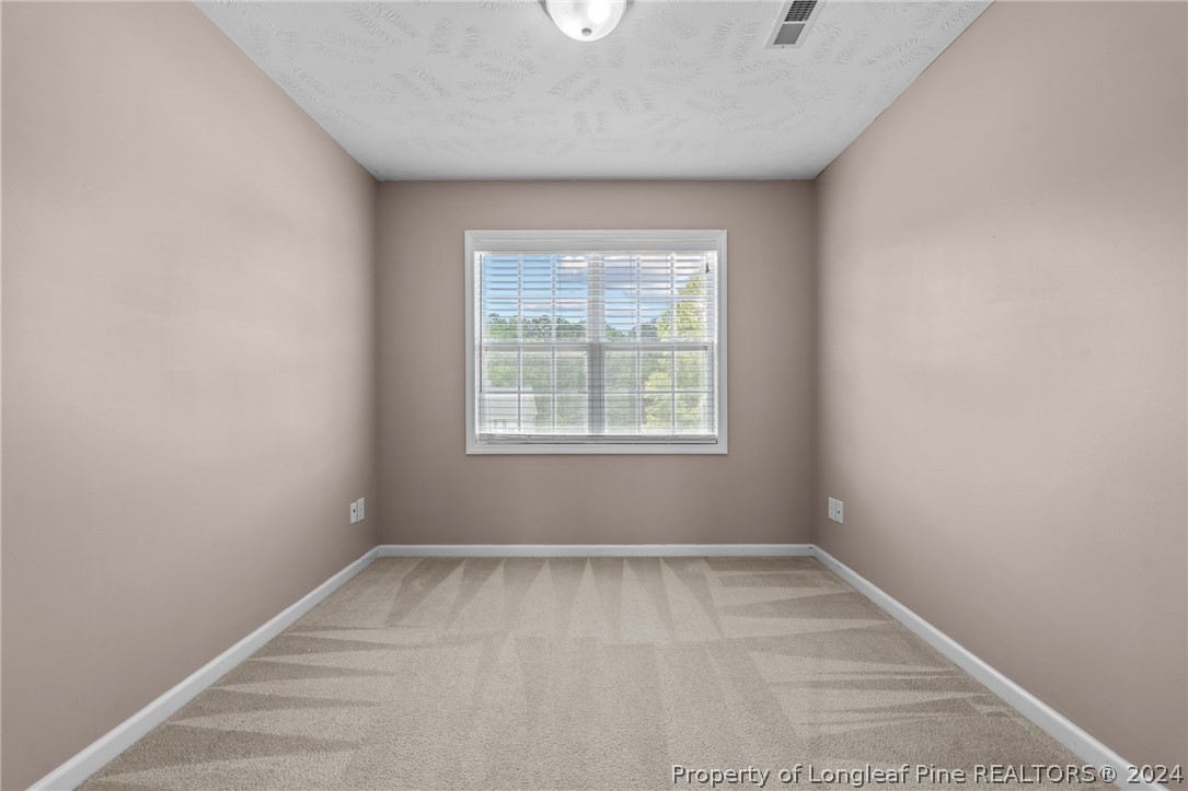 39 Fair Barn Road Sanford, NC 27332 - Photo 24 of 48 an empty room with a window