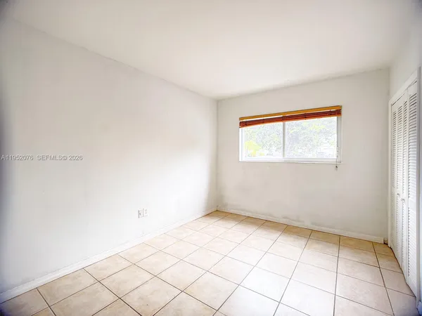 a view of an empty room and window