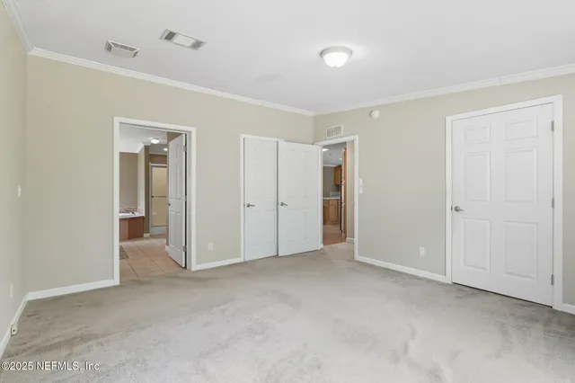 a kitchen with stainless steel appliances granite countertop a refrigerator a sink dishwasher a stove with wooden cabinets and floor