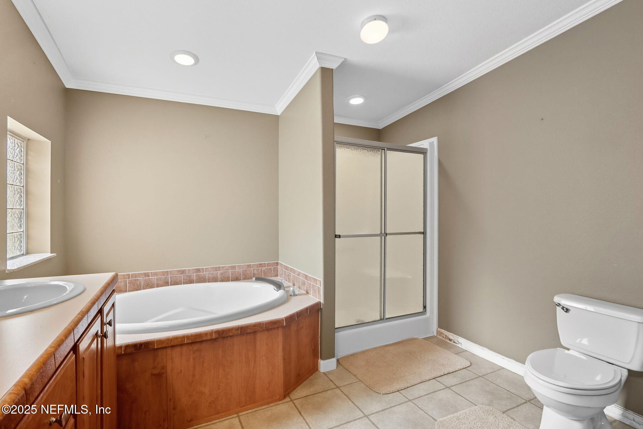 2054 Louie Carter Road Jacksonville, FL 32234 - Photo 17 of 32 a bathroom with a granite countertop sink toilet and shower