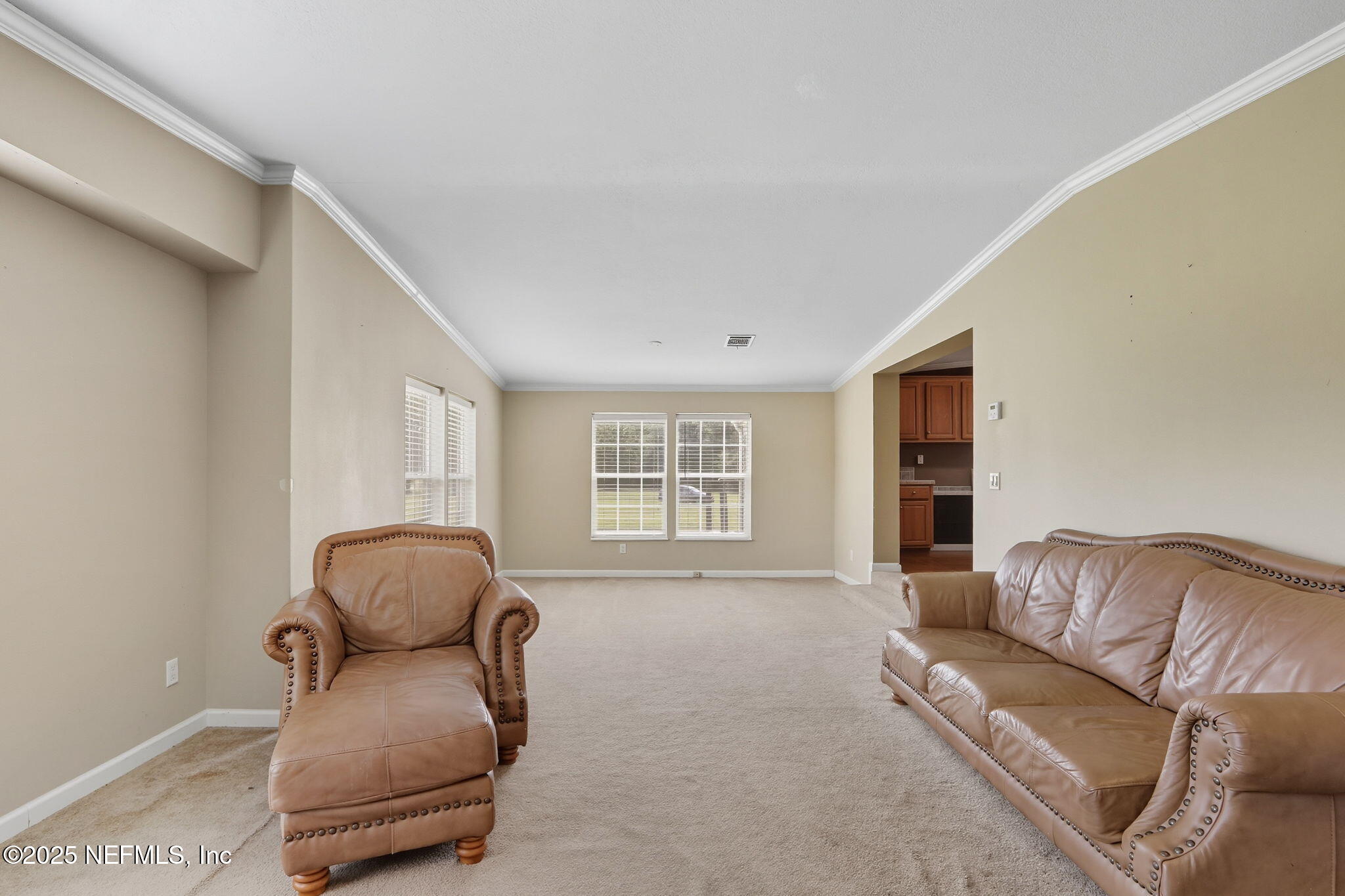 2054 Louie Carter Road Jacksonville, FL 32234 - Photo 23 of 32 a living room with furniture and a window
