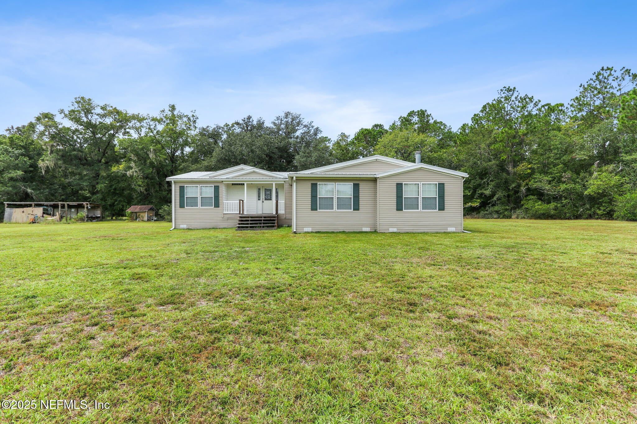 2054 Louie Carter Road Jacksonville, FL 32234 - Photo 27 of 32 a house view with a garden space