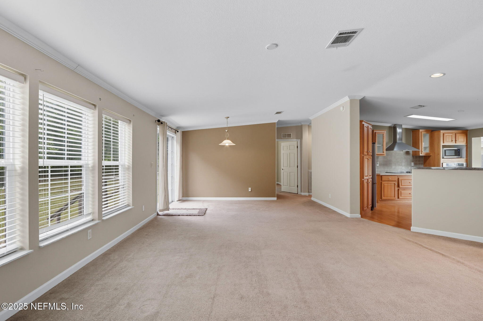 2054 Louie Carter Road Jacksonville, FL 32234 - Photo 7 of 32 a view of an empty room with a window