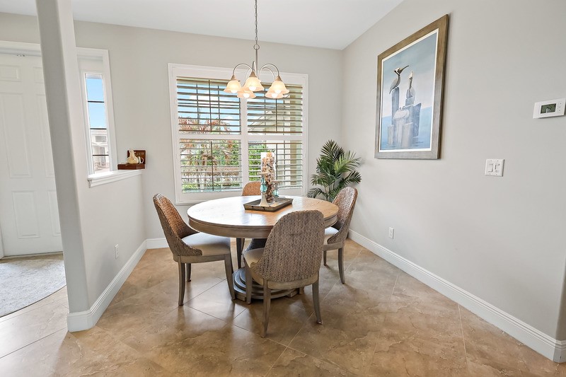 570 Gossamer Wing Way Sebastian, FL 32958 - Photo 11 of 36 a view of a dining room with furniture window and outside view