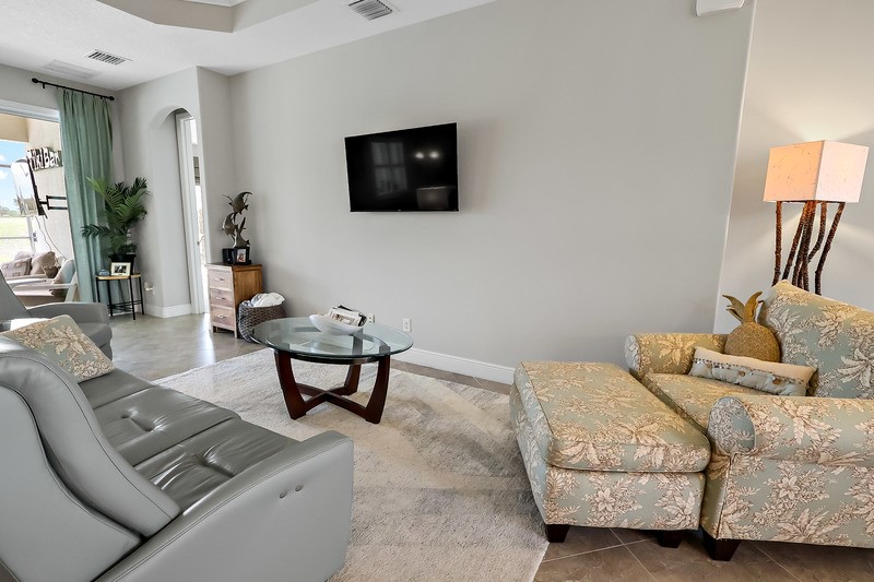 570 Gossamer Wing Way Sebastian, FL 32958 - Photo 13 of 36 a living room with furniture and a flat screen tv