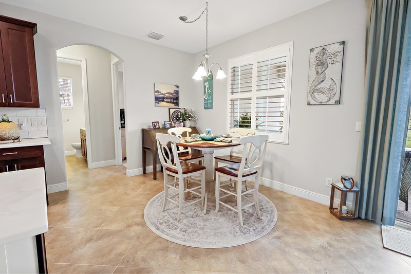570 Gossamer Wing Way Sebastian, FL 32958 - Photo 19 of 36 a view of a dining room with furniture window and outside view