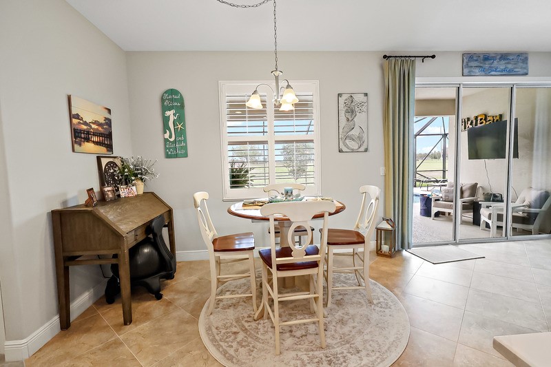 570 Gossamer Wing Way Sebastian, FL 32958 - Photo 20 of 36 a dining room with furniture and window