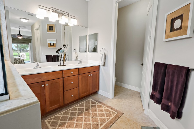 570 Gossamer Wing Way Sebastian, FL 32958 - Photo 24 of 36 a bathroom with a double vanity sink mirror and