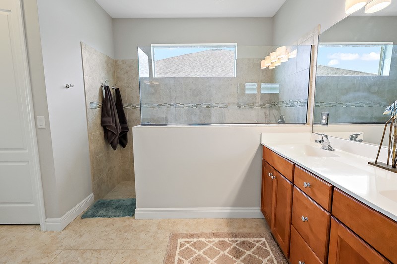 570 Gossamer Wing Way Sebastian, FL 32958 - Photo 25 of 36 a bathroom with a sink and a mirror