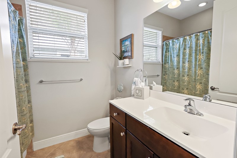 570 Gossamer Wing Way Sebastian, FL 32958 - Photo 28 of 36 a bathroom with a sink a toilet and shower
