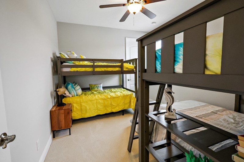 570 Gossamer Wing Way Sebastian, FL 32958 - Photo 30 of 36 a bedroom with a bed and a walk in closet