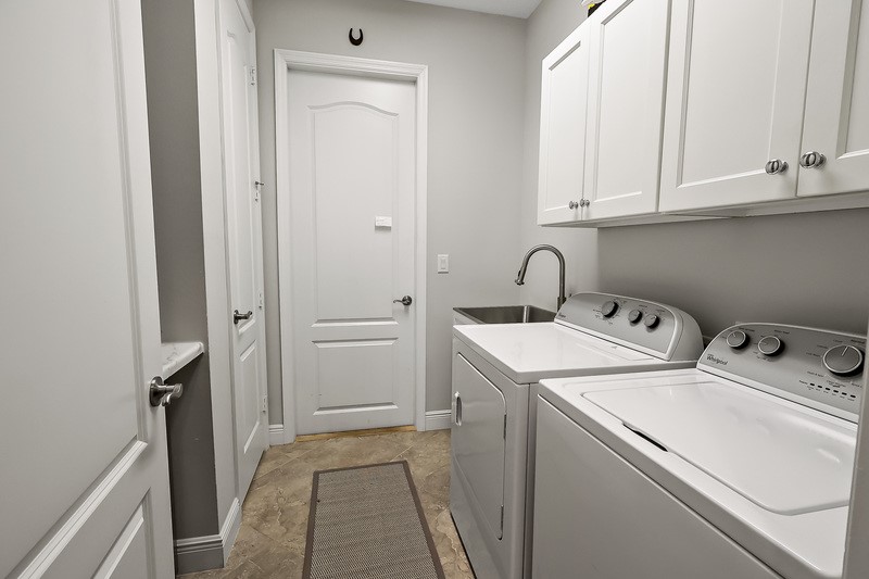 570 Gossamer Wing Way Sebastian, FL 32958 - Photo 31 of 36 a utility room with dryer and washer