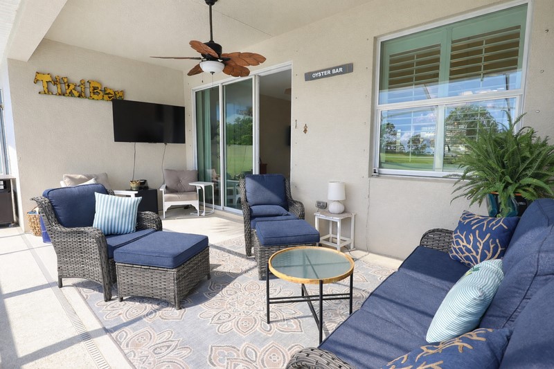 570 Gossamer Wing Way Sebastian, FL 32958 - Photo 32 of 36 a living room with furniture a flat screen tv and a window