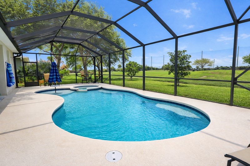 570 Gossamer Wing Way Sebastian, FL 32958 - Photo 34 of 36 a view of a swimming pools under an umbrella