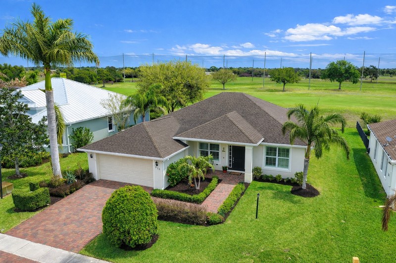 570 Gossamer Wing Way Sebastian, FL 32958 - Photo 36 of 36 a house with green field in front of it