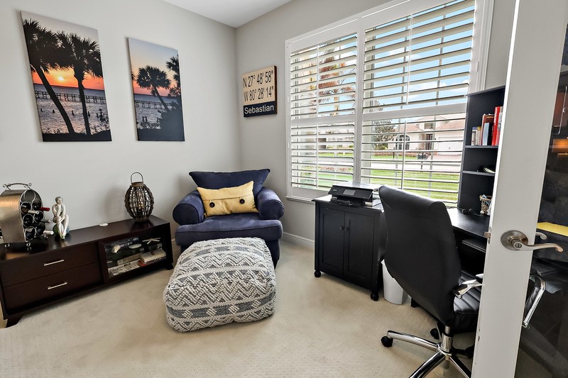 570 Gossamer Wing Way Sebastian, FL 32958 - Photo 9 of 36 a bedroom with a bed and wooden floor