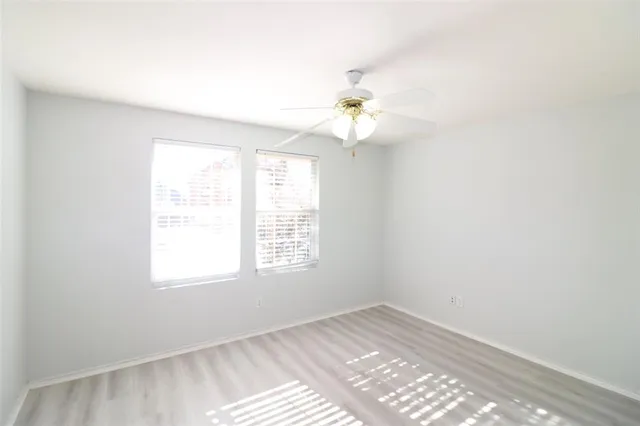 a view of a backyard with fence